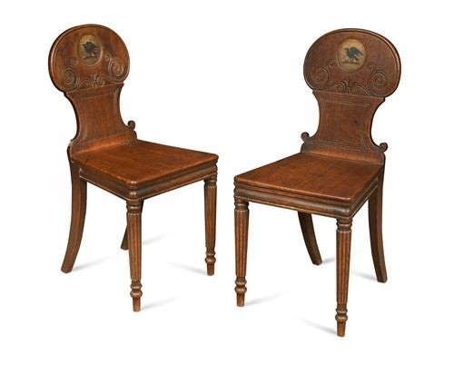 Lot 912 - A pair of Regency oak hall chairs
