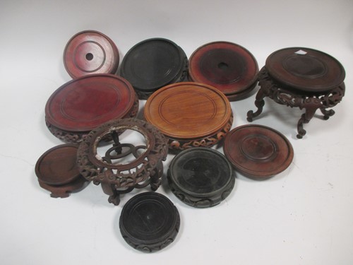 Lot 51 - A quantity of Oriental hardwood vase stands