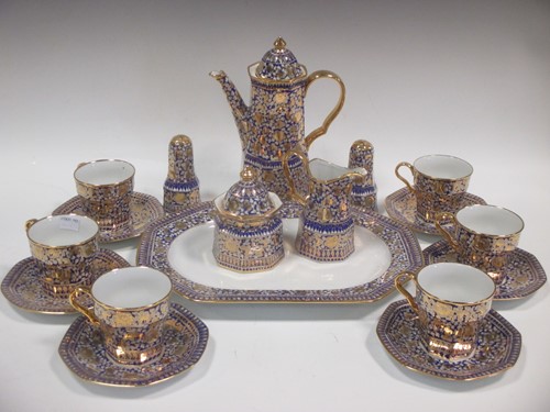 Lot 54 - A blue and gilt porcelain coffee service