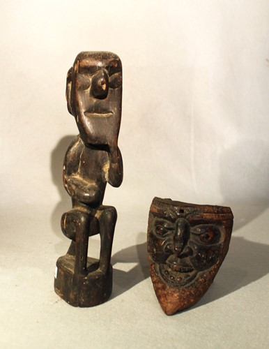 Lot 62 - A carved wood seated figure, perhaps Africa or...