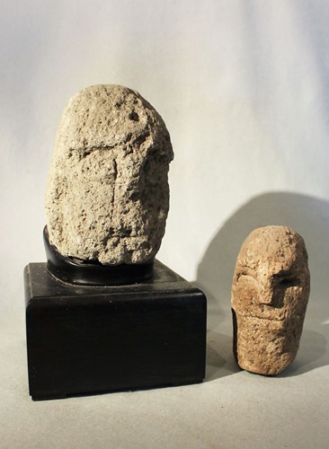 Lot 96 - A carved tufa primitive head, perhaps early...