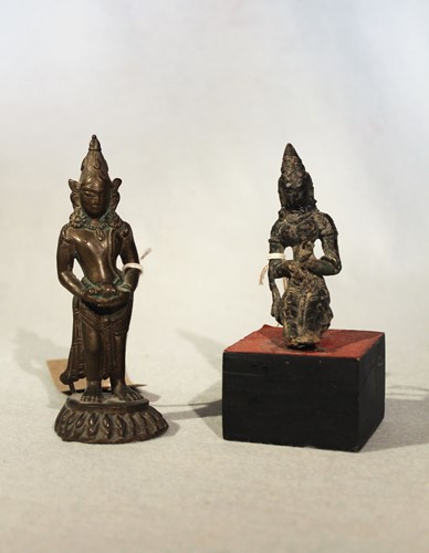 Lot 122 - An Indian bronze seated deity, probably Shiva,...