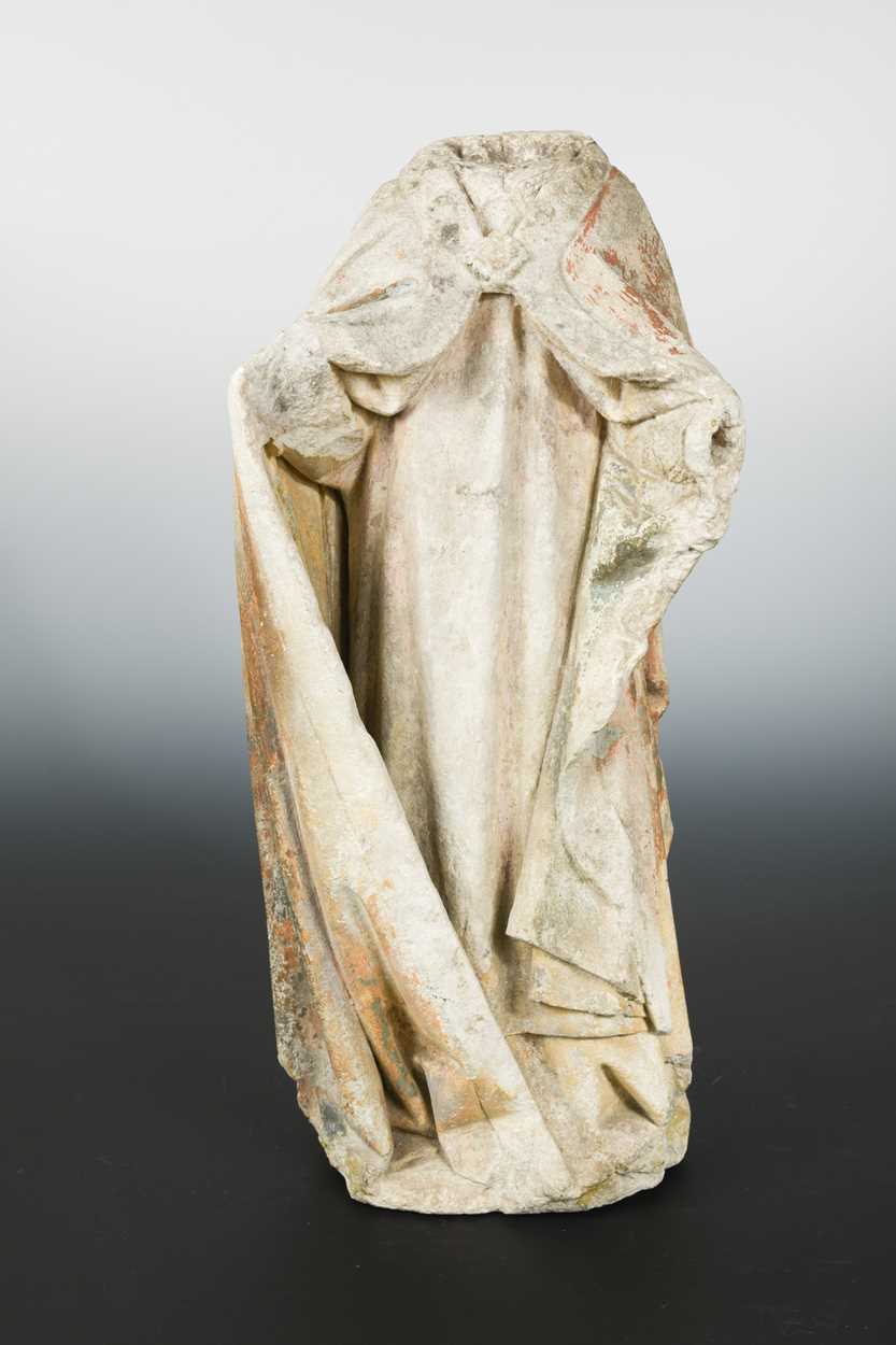 Lot 419 - A French carved limestone torso fragment of