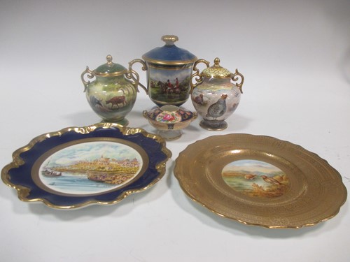 Lot 31 - Two porcelain vases and covers painted with...