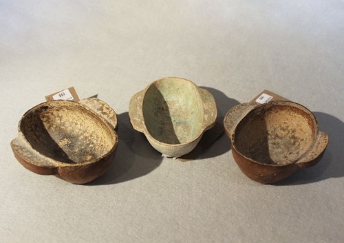 Lot 423 - Three Chinese tab handled pottery ear cups, Han Dynasty or earlier
