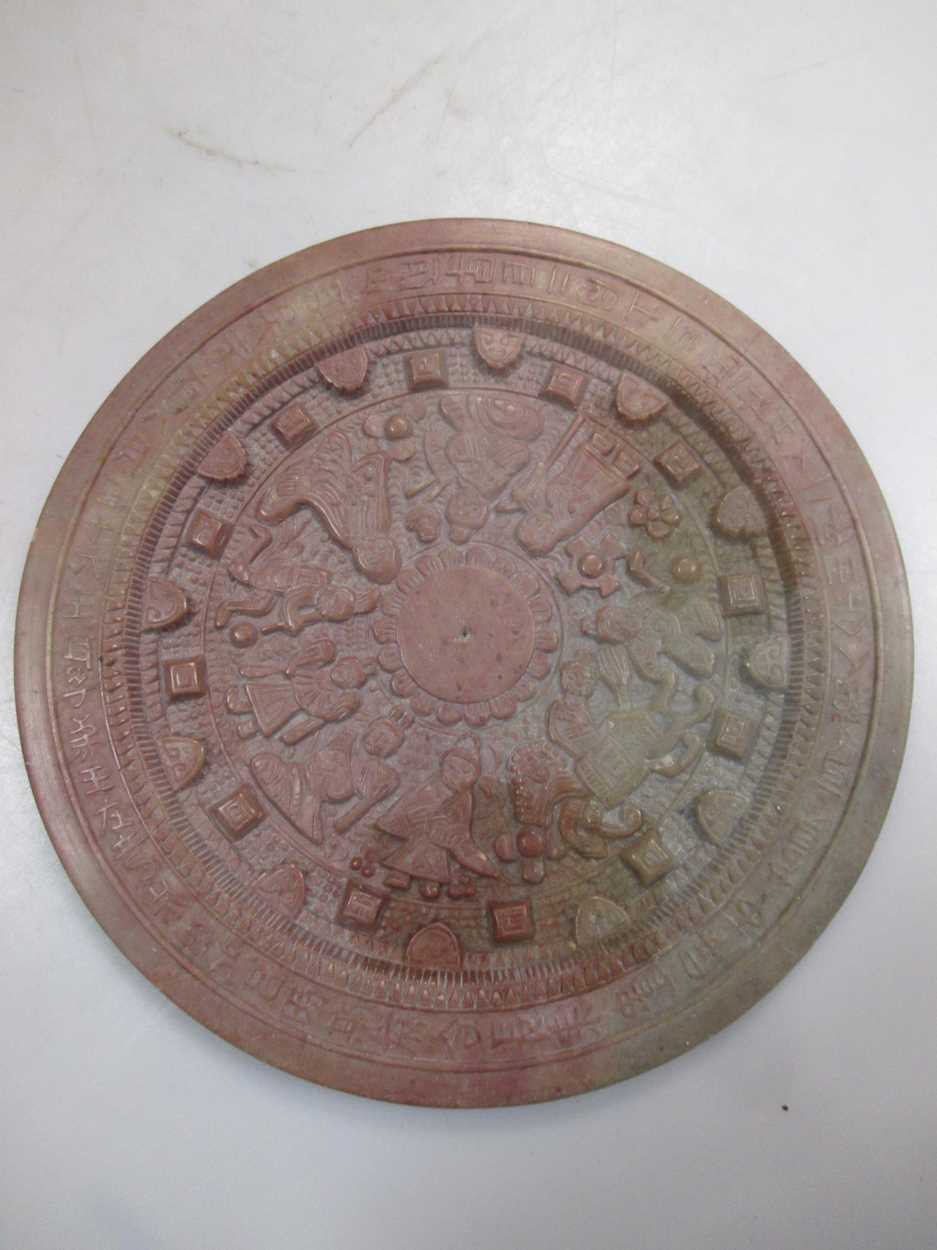 Lot 132 - A Chinese carved soapstone astrological disc,...