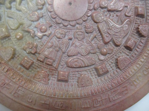 Lot 132 - A Chinese carved soapstone astrological disc,...