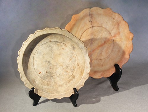 Lot 426 - A Chinese turned and carved white marble barbed circular shallow dish, possibly late Tang Dynasty