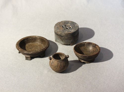Lot 138 - A group of four Chinese green and grey stone...