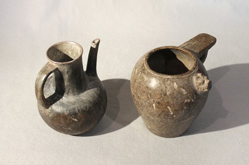 Lot 101 - A Chinese mottled greenstone pouring vessel in...
