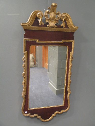 Lot 698 - A George II style walnut and parcel gilt wall...