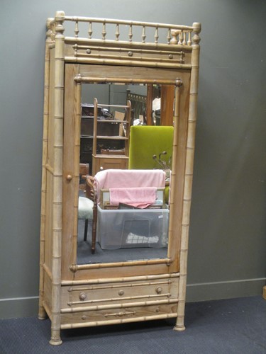 Lot 645 - A Victorian faux bamboo pine wardrobe with...