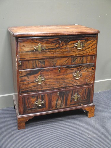 Lot 700 - An 18th century coromandel veneered chest of...