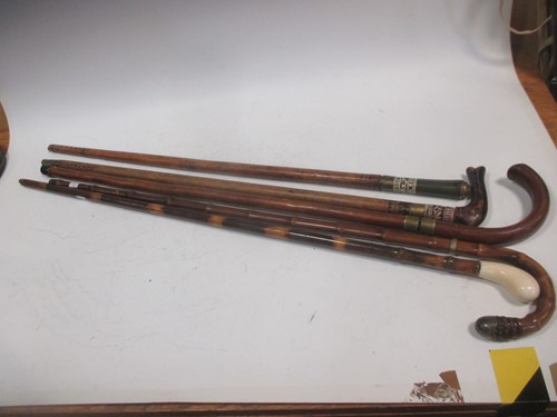 Lot 151 - Four various early 20th century sword sticks...