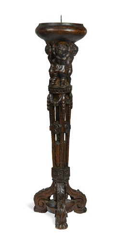 Lot 64 - A late 16th or early 17th century Flemish carved pricket candlestick