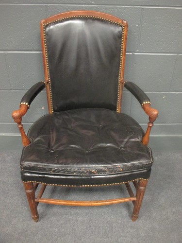 Lot 568 - A continental Louis XVI style elbow chair in...