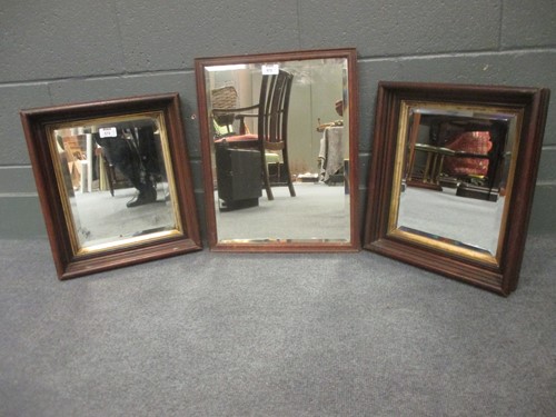 Lot 572 - A pair of wooden framed mirrors with bevelled...
