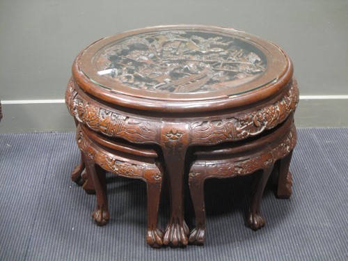 Lot 731 - A Chinese carved circular low table with four...