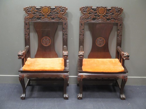 Lot 733 - A pair of high back Chinese carved teak...