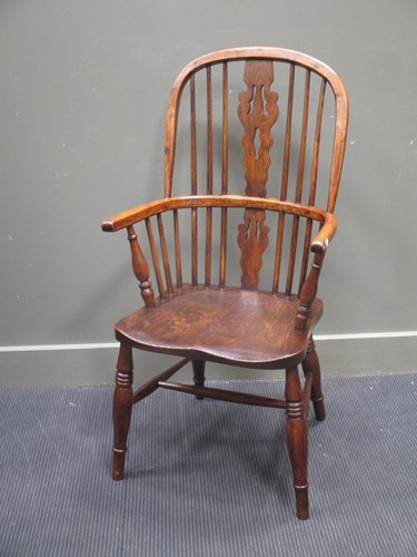 Lot 580 - A 19th century elm and ash stick back Windsor...