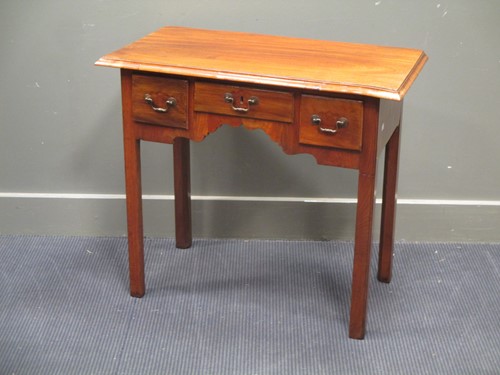 Lot 609 - Circa 1800 A walnut lowboy of three drawers on...
