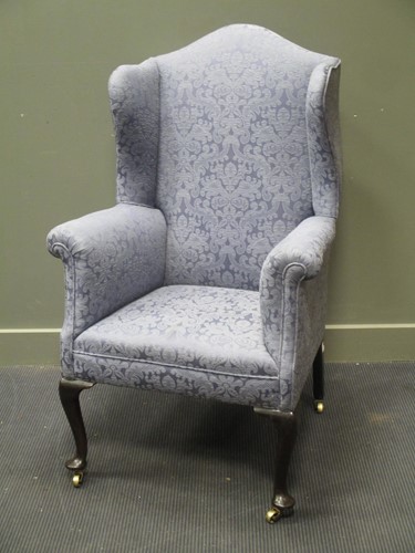 Lot 702 - A 19th century mahogany wing back armchair on...