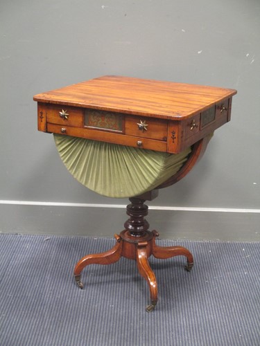 Lot 678 - A Regency mahogany work table with brass...