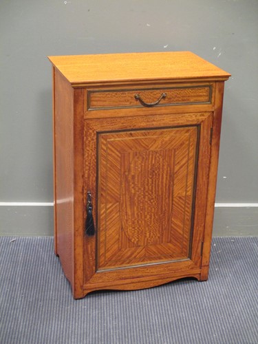Lot 614 - A French 19th century satinwood cabinet with...