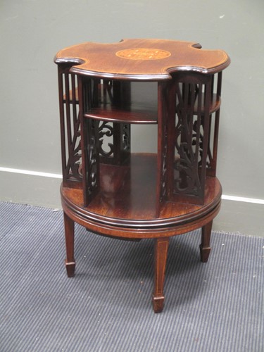 Lot 675 - A 19th century inlaid mahogany revolving...