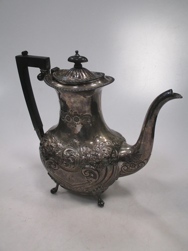 Lot 297 - A Chester silver coffee pot, embossed with...