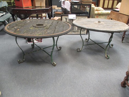 Lot 578 - Two low garden tables formed from cart wheels...
