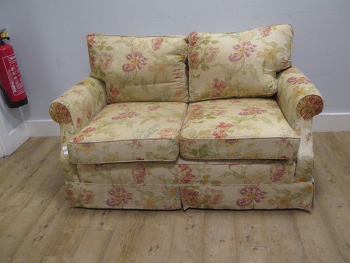 Lot 495 - A modern floral upholstered two-seater sofa,...