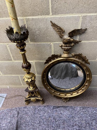 Lot 553 - A Regency style gilt convex mirror with eagle...