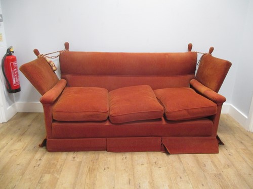 Lot 484 - A red upholstered Knowle sofa, 190cm wide