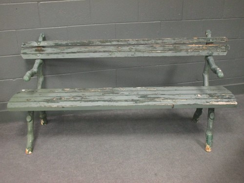 Lot 523 - A Victorian cast iron garden bench with timber...
