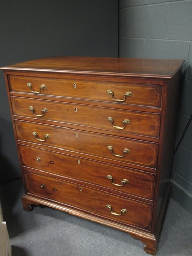 Lot 567 - A George III mahogany chest of five long...