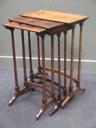 Lot 485 - Three Regency mahogany nesting tables (not...
