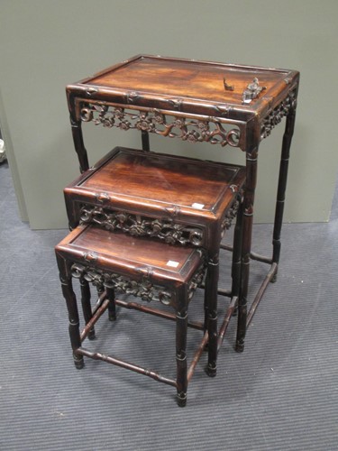 Lot 705 - Three Oriental hardwood tables, part of a...
