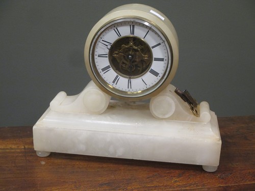 Lot 122 - A wall clock, an Alabaster mantel clock