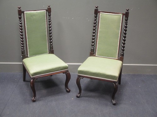 Lot 476 - A pair of Victorian rosewood nursing chairs (2)
