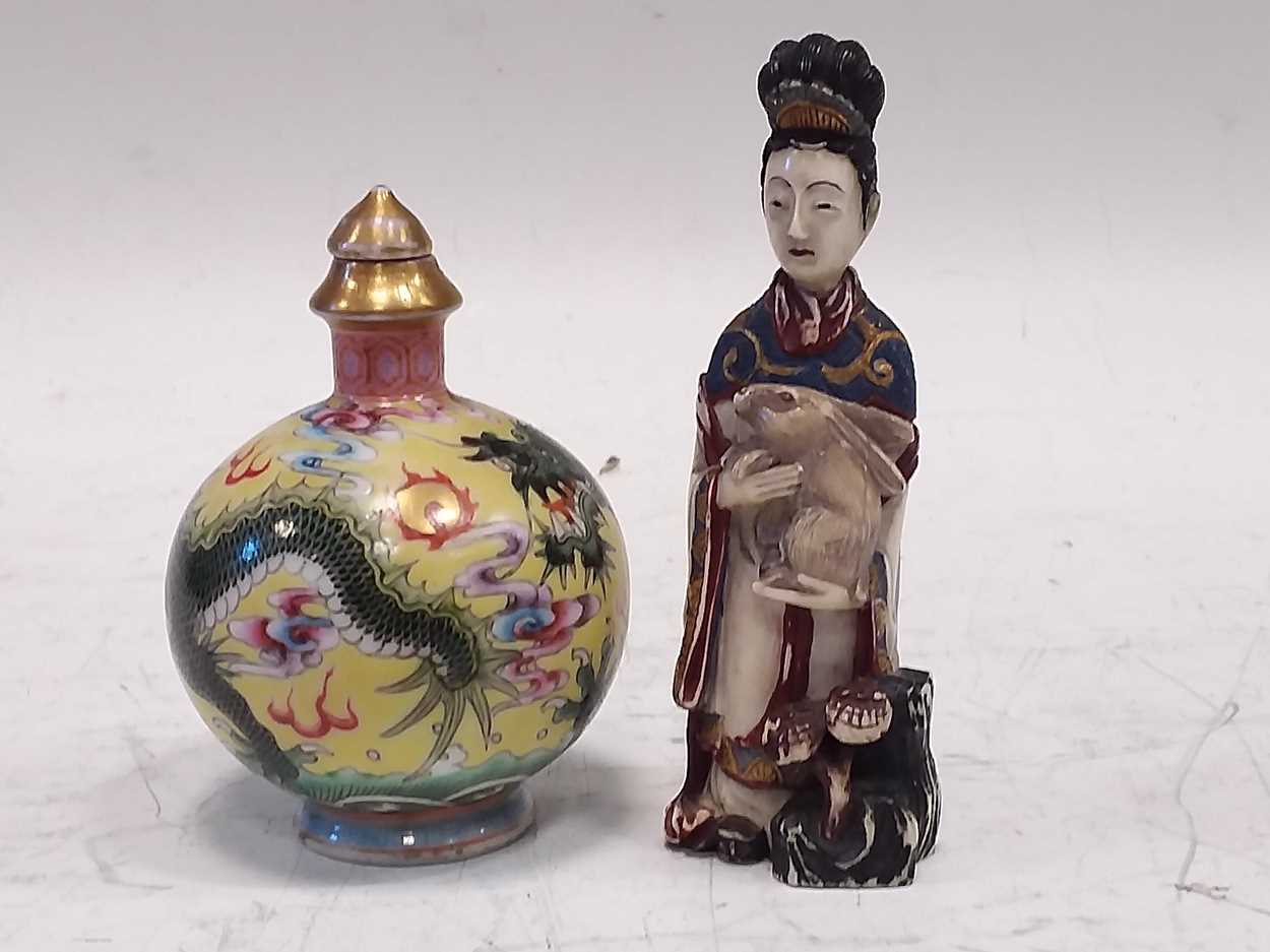 Lot 307 - A Chinese carved and painted ivory snuff...