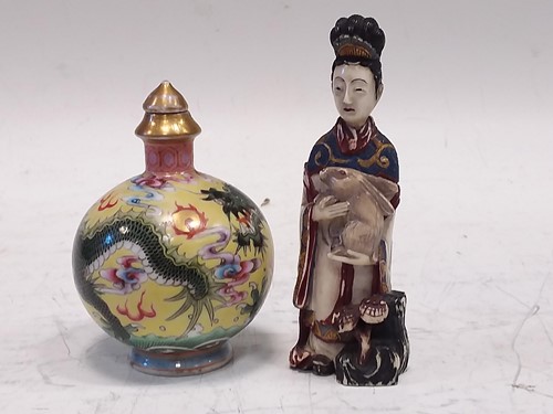 Lot 54 - A Chinese carved and painted ivory snuff...