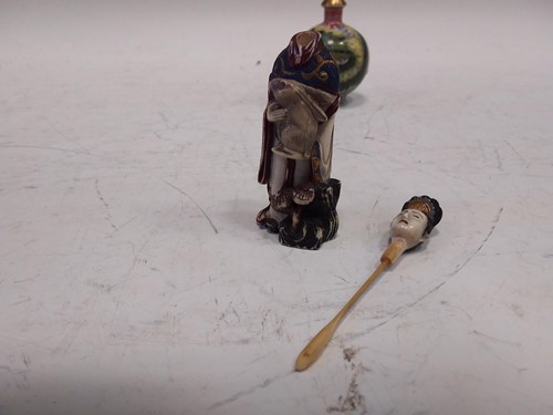 Lot 307 - A Chinese carved and painted ivory snuff...