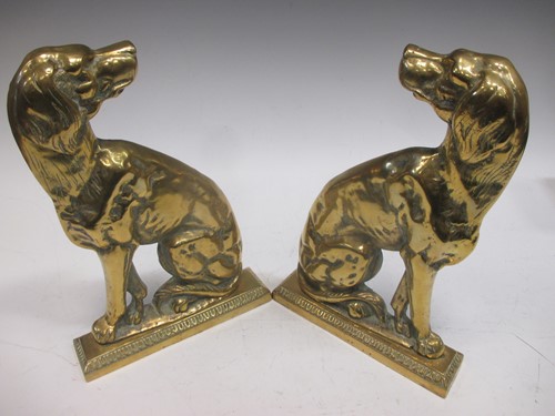 Lot 125 - A pair of brass spaniel dog side profile door...