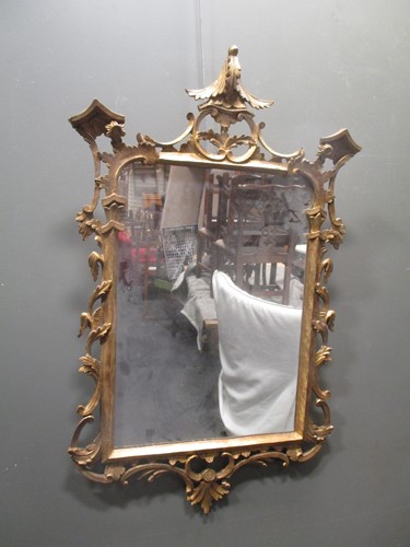 Lot 481 - A carved and giltwood wall mirror, 100 x 63cm