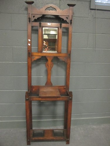 Lot 738 - An early 20th century oak hall stand 195x 61x30cm