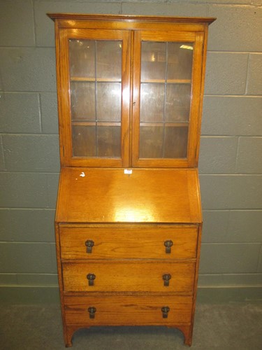 Lot 737 - An early 20th century oak bureau bookcase 170x...