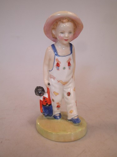Lot 206 - A Royal Doulton figure of a boy holding a...