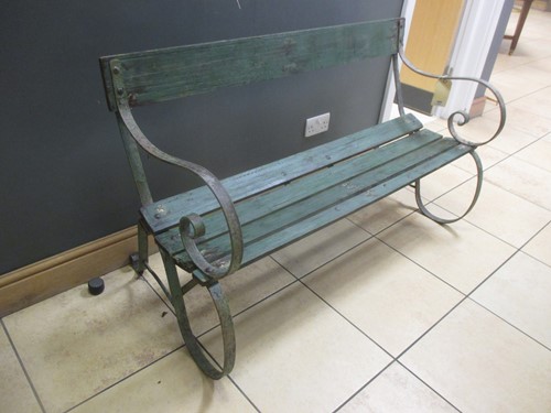 Lot 752 - A green painted wood and metal slatted garden...