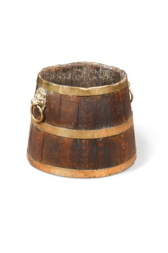 Lot 858 - An oak brass bound log bin in half barrel form, early 19th century